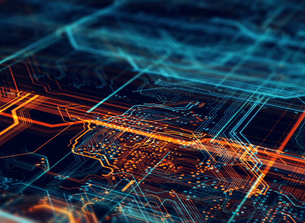 Abstract image of a computer circuit board with glowing orange and blue lines, resembling electronic pathways and connections, creating a futuristic and high-tech visual effect.