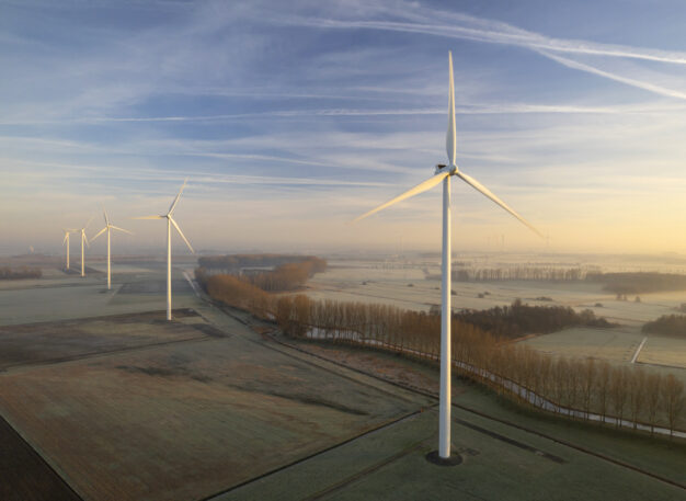 A group of windmills in a field.