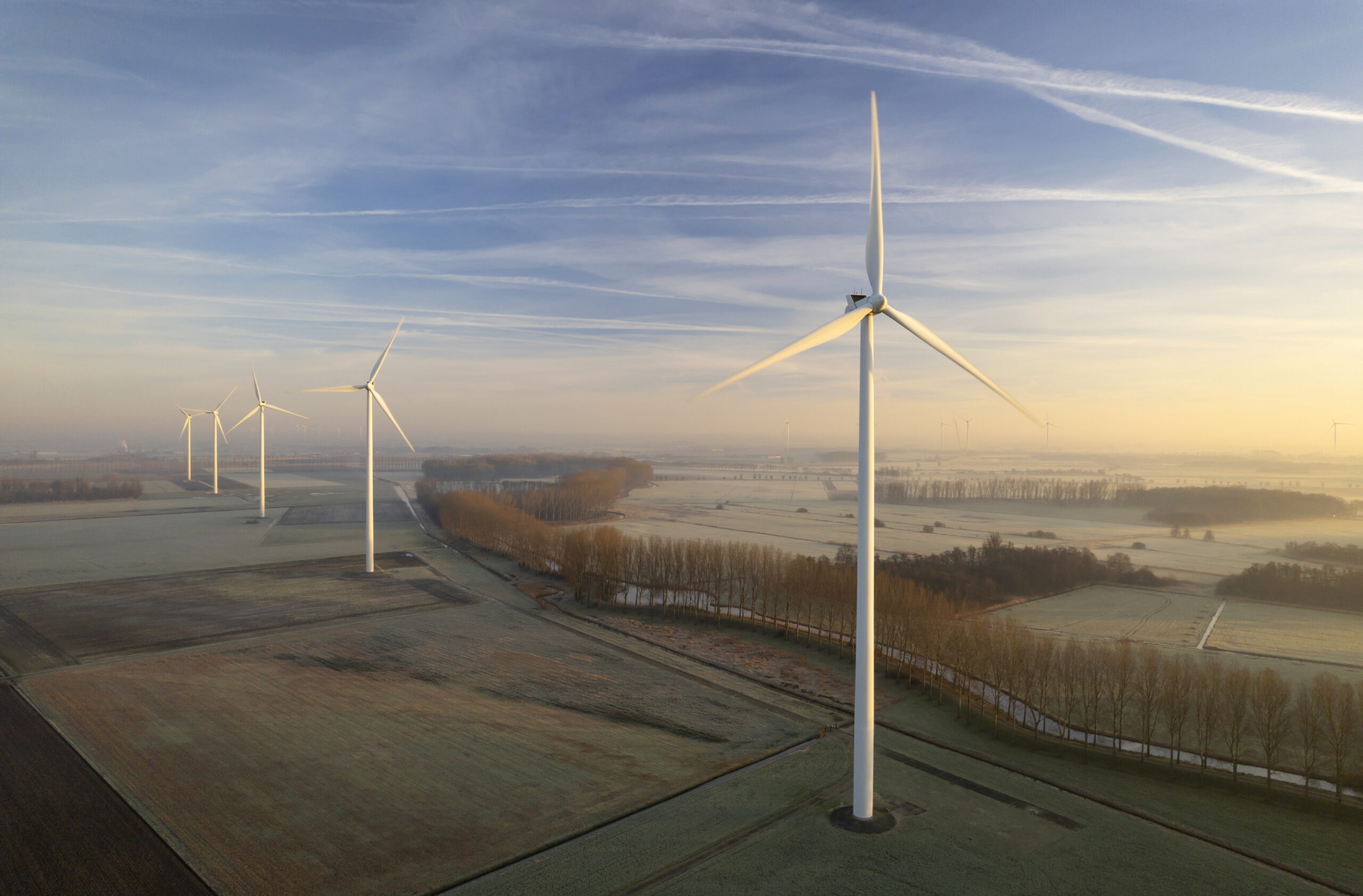 A group of windmills in a field.