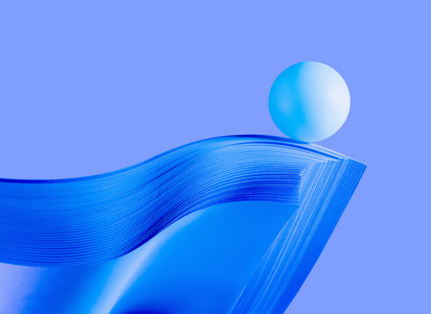 A smooth, light blue sphere balances on the curved edge of a stack of glossy, blue sheets against a solid light purple background.