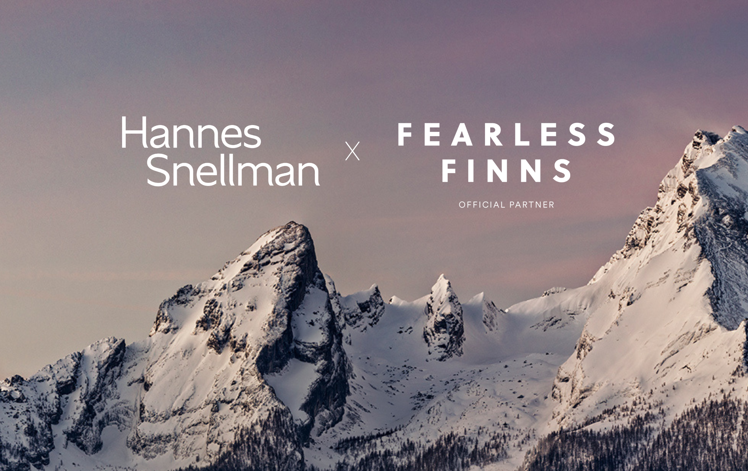 Snow-covered mountain peaks under a pink and purple sky, with the text “Hannes Snellman x Fearless Finns Official Partner” overlaid on the left and center of the image.